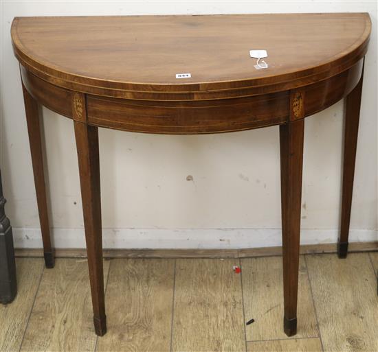 A George III inlaid mahogany demi-lune table, W.92cm